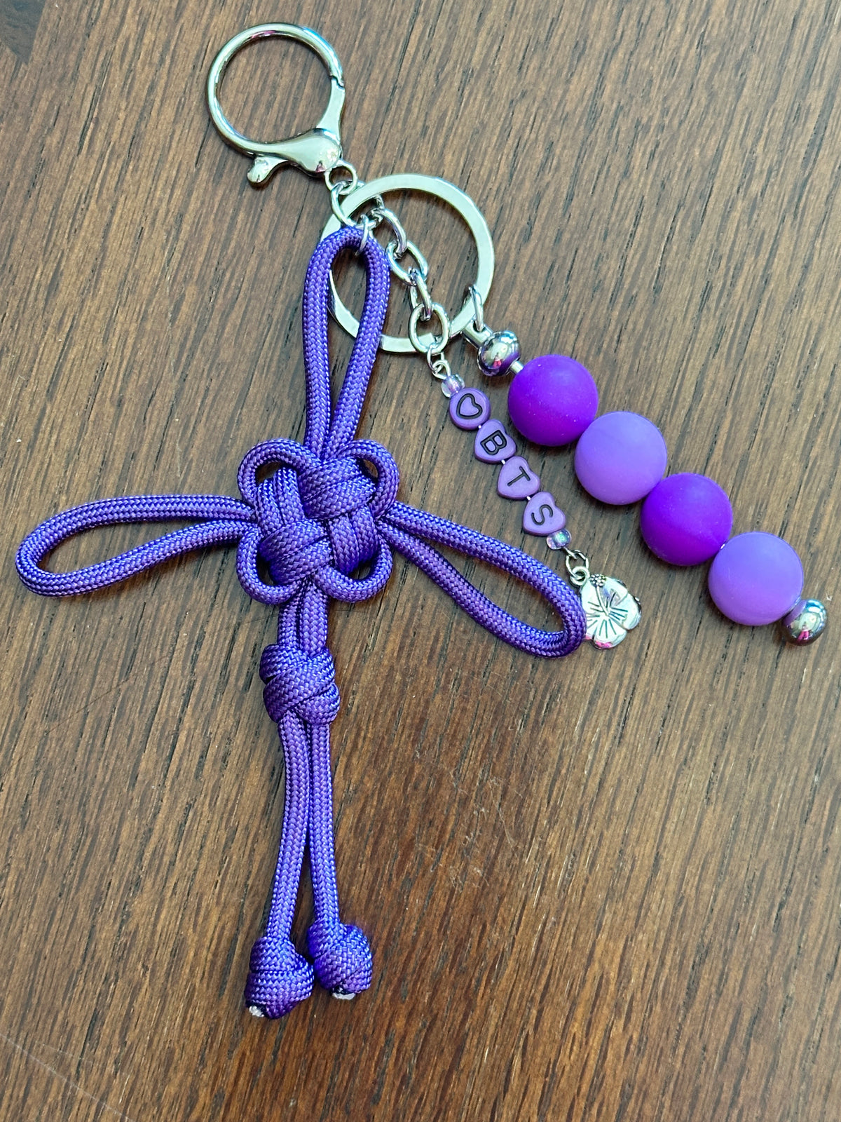 Dongsimgyol Knot, featuring stacked silicone beads - your choice of 'BTS" or Bias - RM, Jin, Suga, J-Hope, Jimin, V, JK. Hibiscus charm featured here, as one of your choices.
